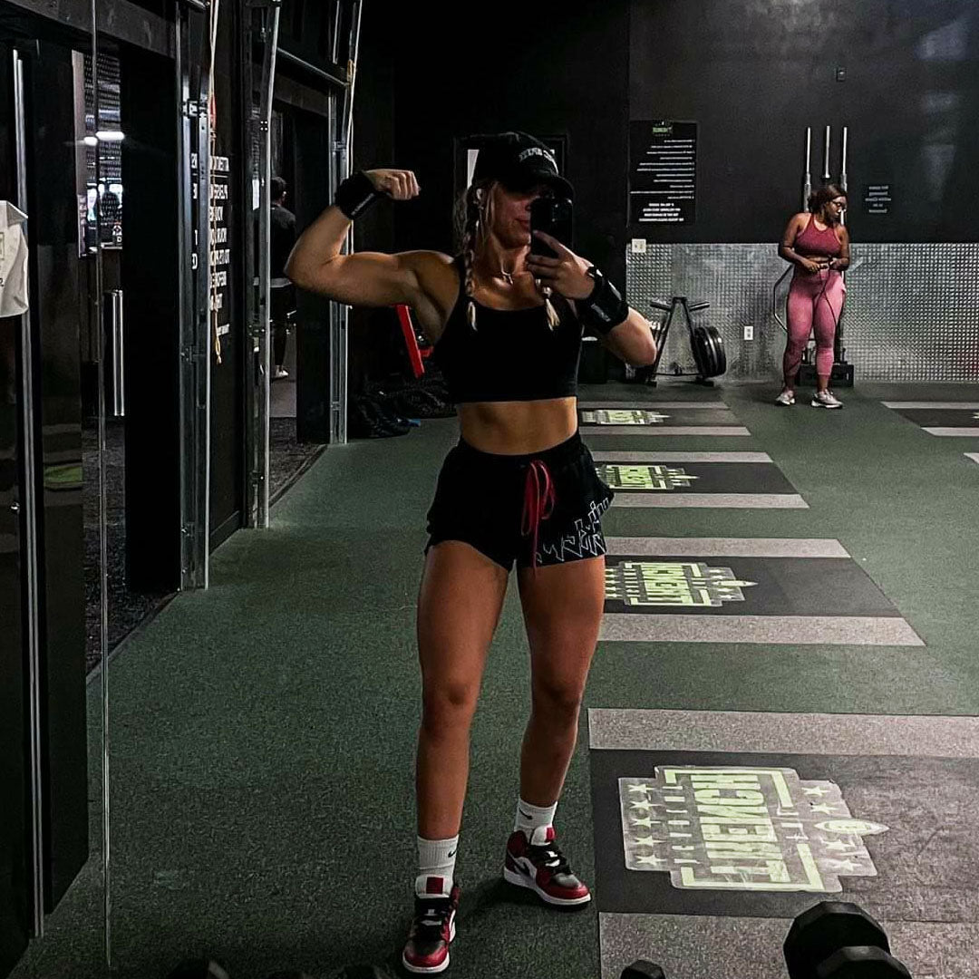 liz posing with black freestyle wraps